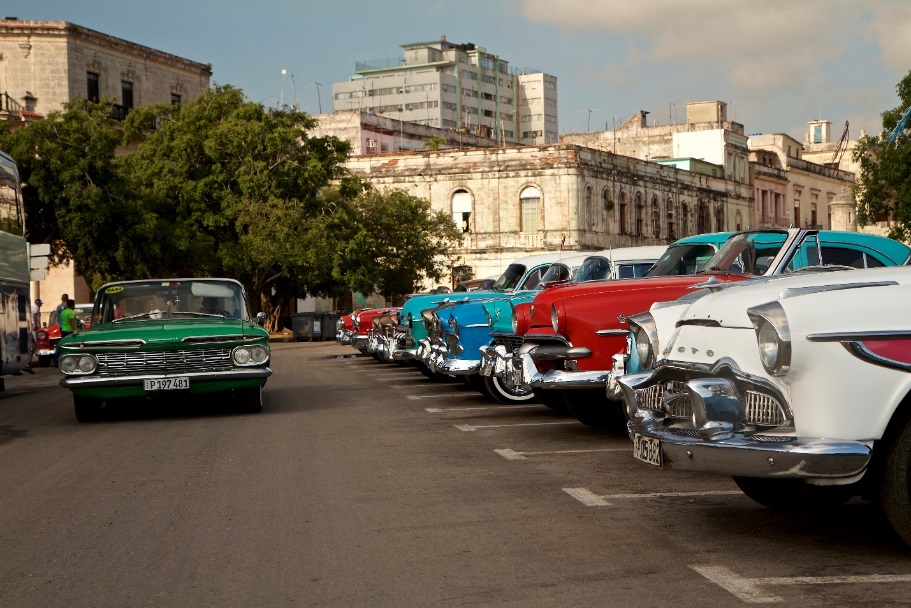 A car driving on a city street Description automatically generated